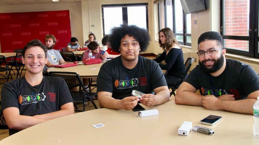 summer bridge students at round table in lounge